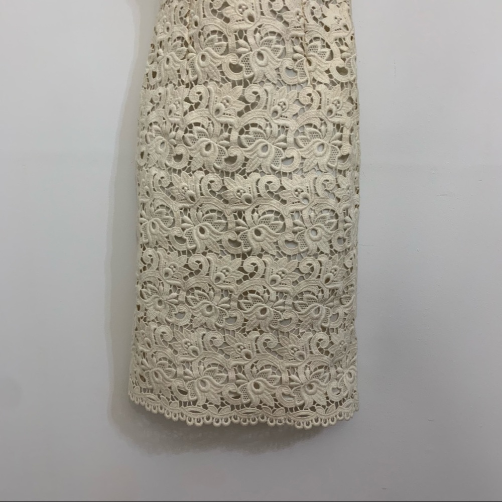 Ivory lace dress by Michael Kors is in like new condition. Size 2 - Picture 9 of 16